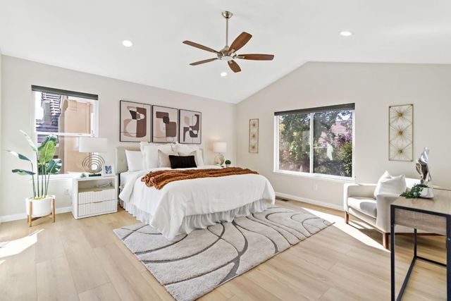 a bed sitting in a bedroom and window