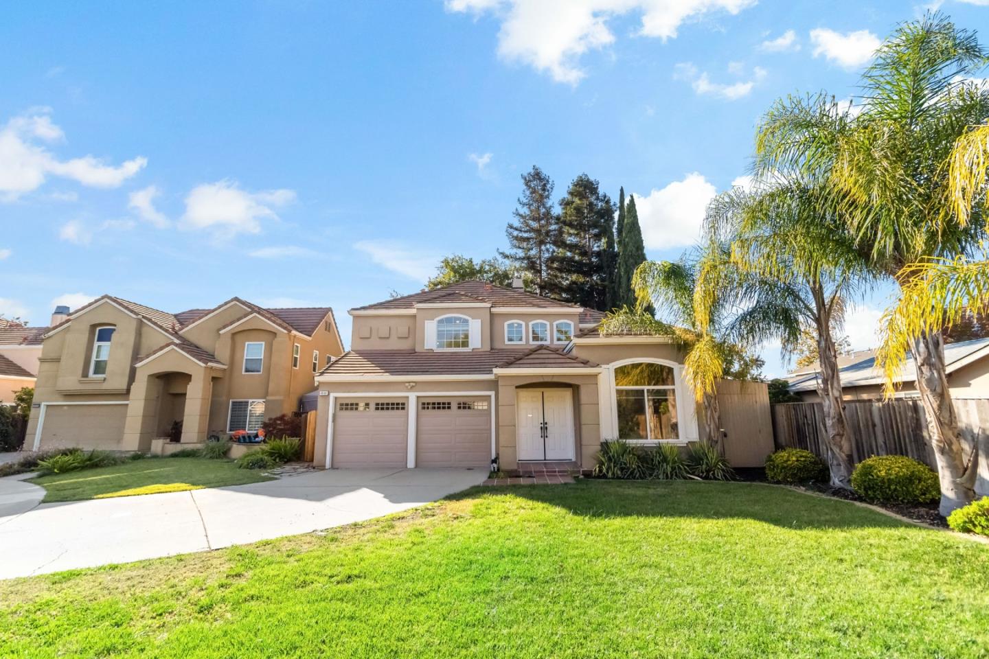 4593 Fallstone Court San Jose, CA 95124 - Photo 7 of 59 a front view of a house with a yard and garage
