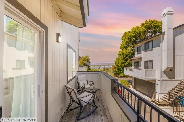 a view of balcony with furniture