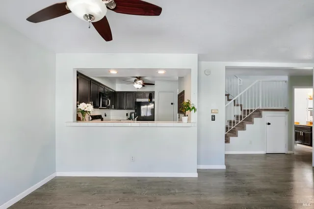 a view of living room with furniture and wooden floor