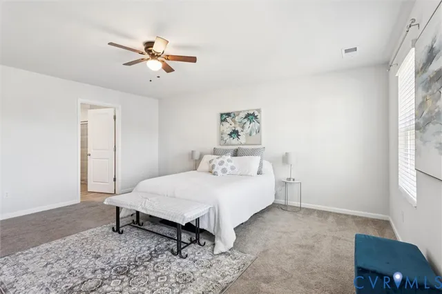 a bed room with a bed and a window