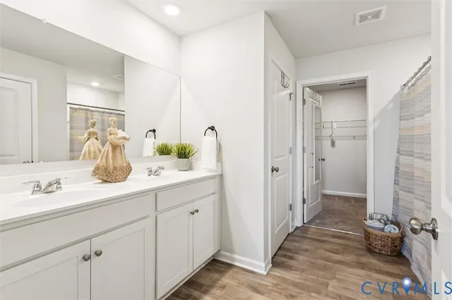 a bathroom with a shower and a sink