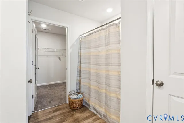 a view of an empty walk in closet