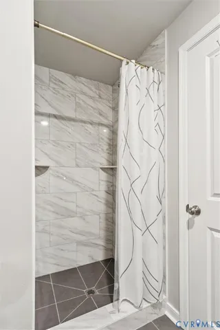 a bathroom with a granite countertop toilet sink and mirror