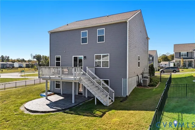 a view of a house with swimming pool and a yard