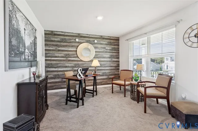 a view of a livingroom with furniture and windows
