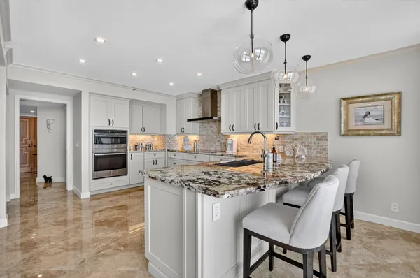 a bedroom with a large bed and a large window