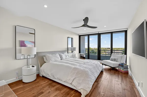 a bathroom with a granite countertop double sink and a mirror