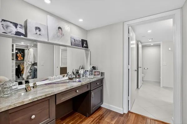 a spacious bedroom with two beds and a large window