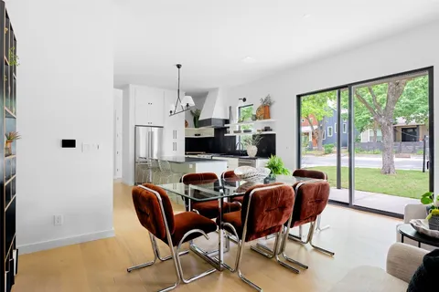 a view of a dining room with furniture window and outside view