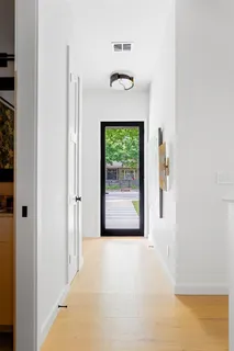a view of a hallway with a window