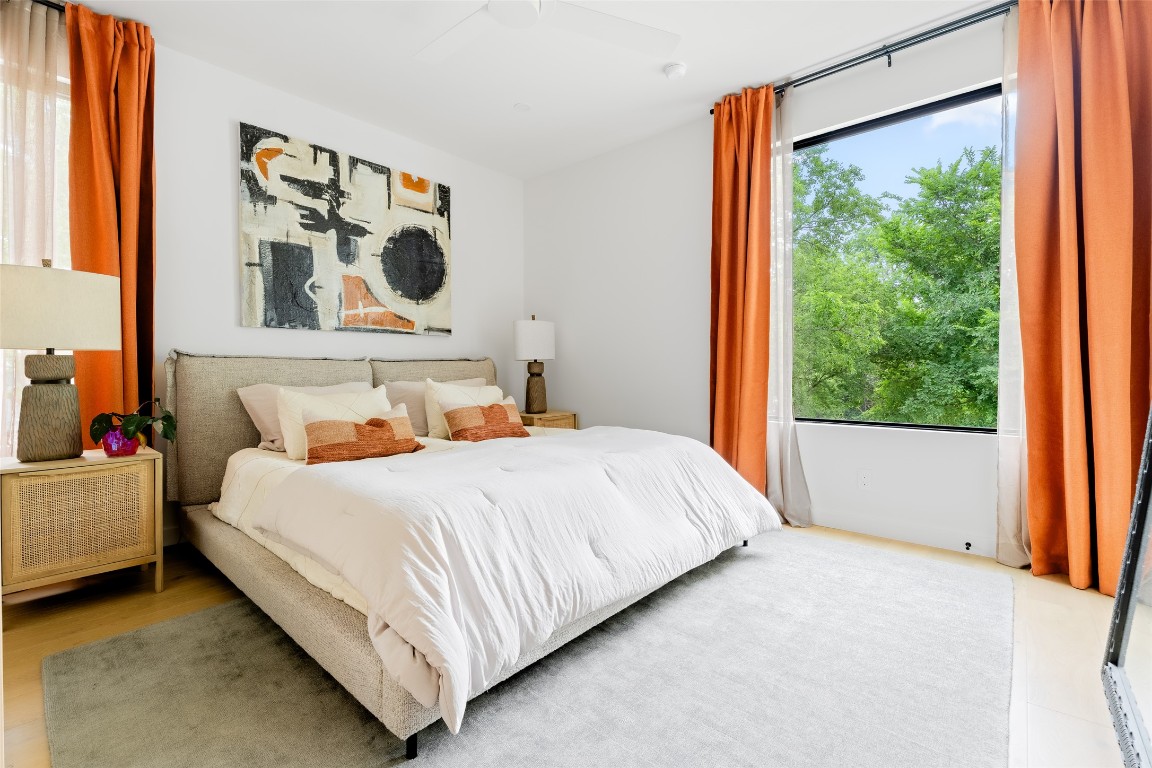 4911 Duval Street Austin, TX 78751 - Photo 18 of 40 a bedroom with a bed and window