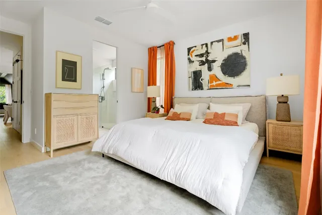 a bedroom with a bed and cabinets