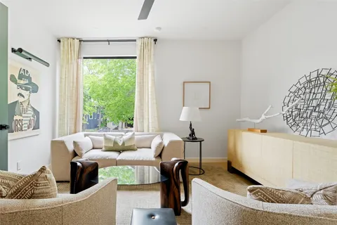 a bed room with a bed and a chair