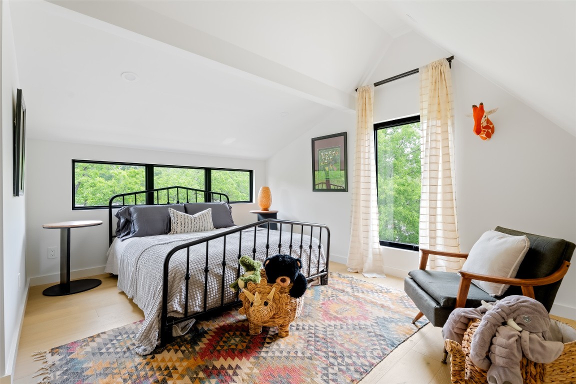 4911 Duval Street Austin, TX 78751 - Photo 27 of 40 a bed room with a bed and a chair