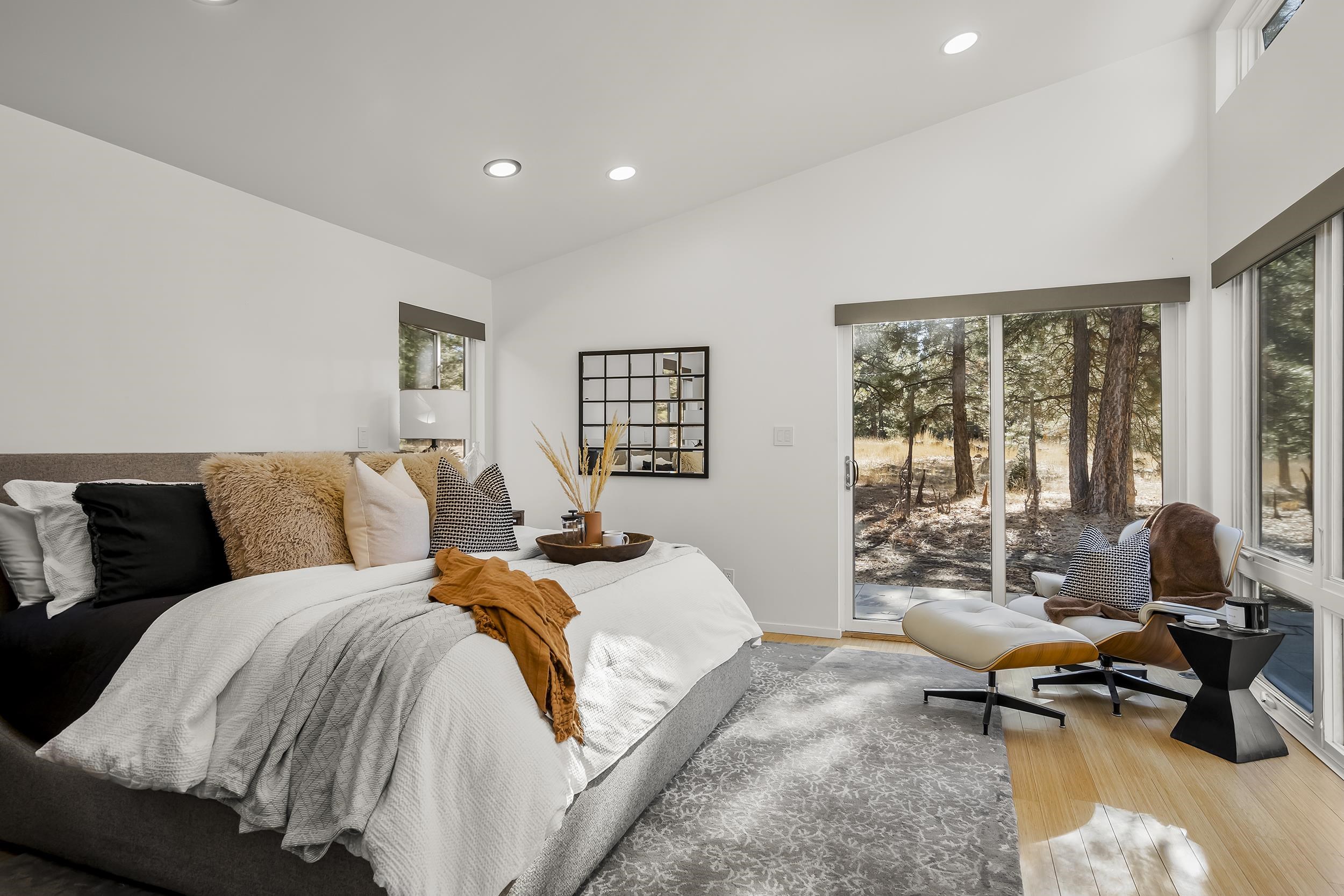 11906 Stallion Way Truckee, CA 96161 - Photo 14 of 20 a spacious bedroom with a bed and a couch