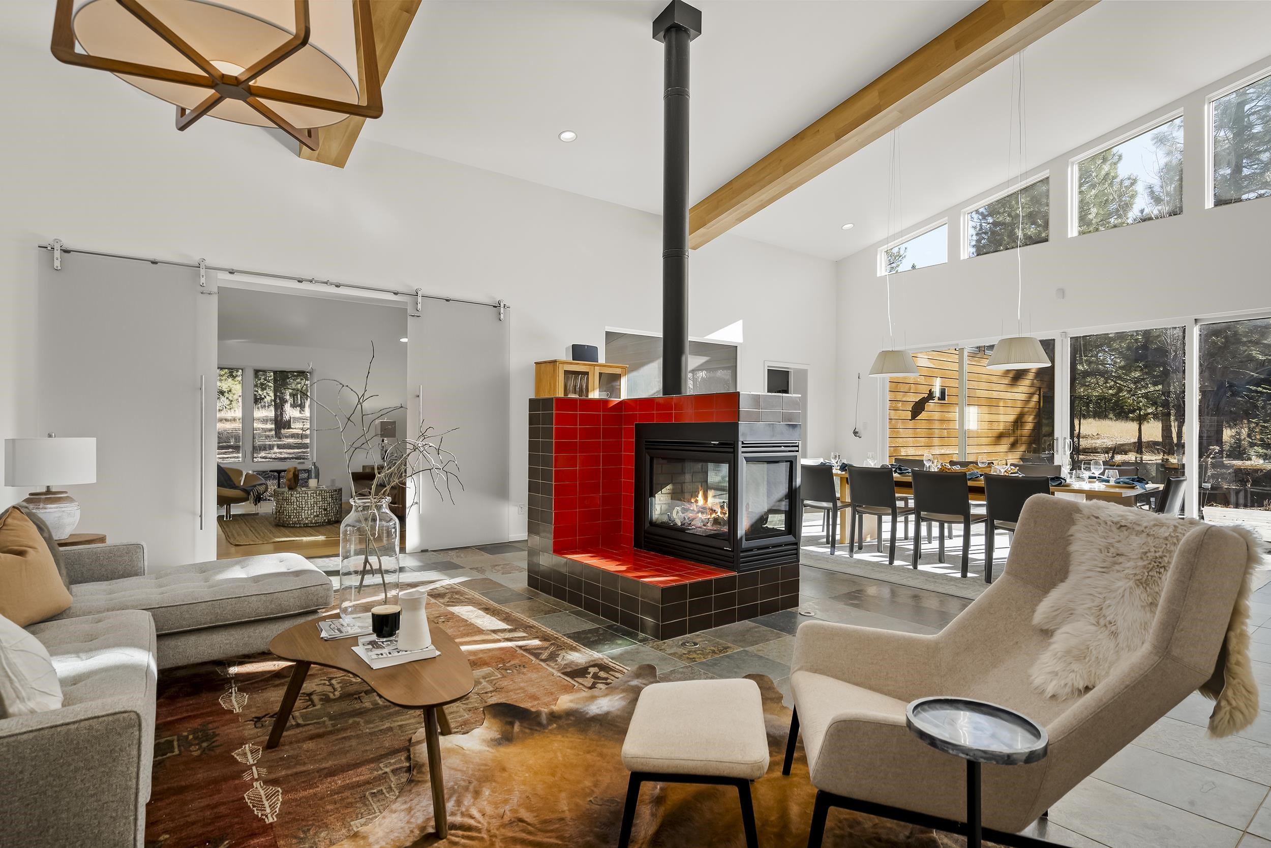 11906 Stallion Way Truckee, CA 96161 - Photo 6 of 20 a living room with furniture a rug and a large window
