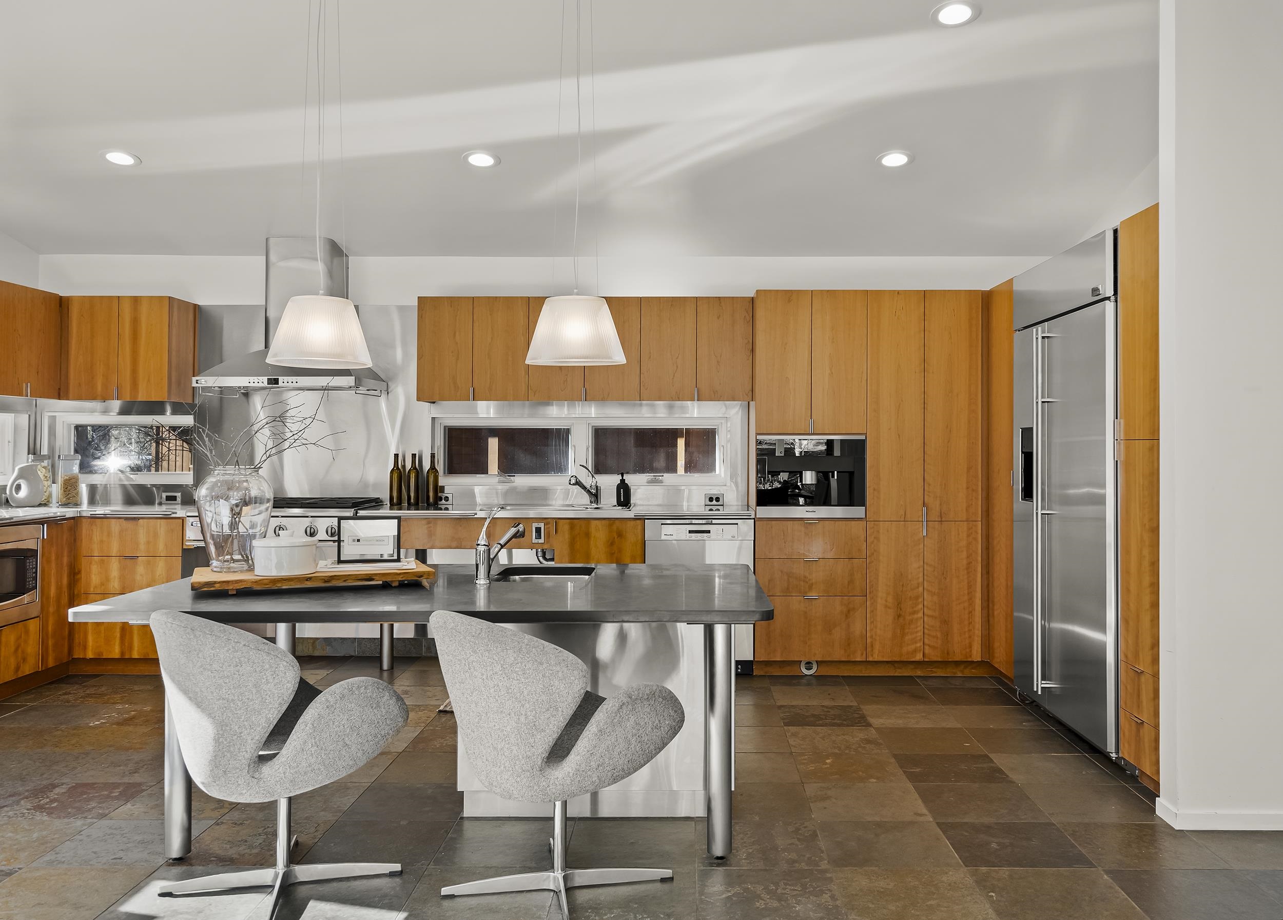 11906 Stallion Way Truckee, CA 96161 - Photo 9 of 20 a kitchen with stainless steel appliances granite countertop a stove and more cabinets