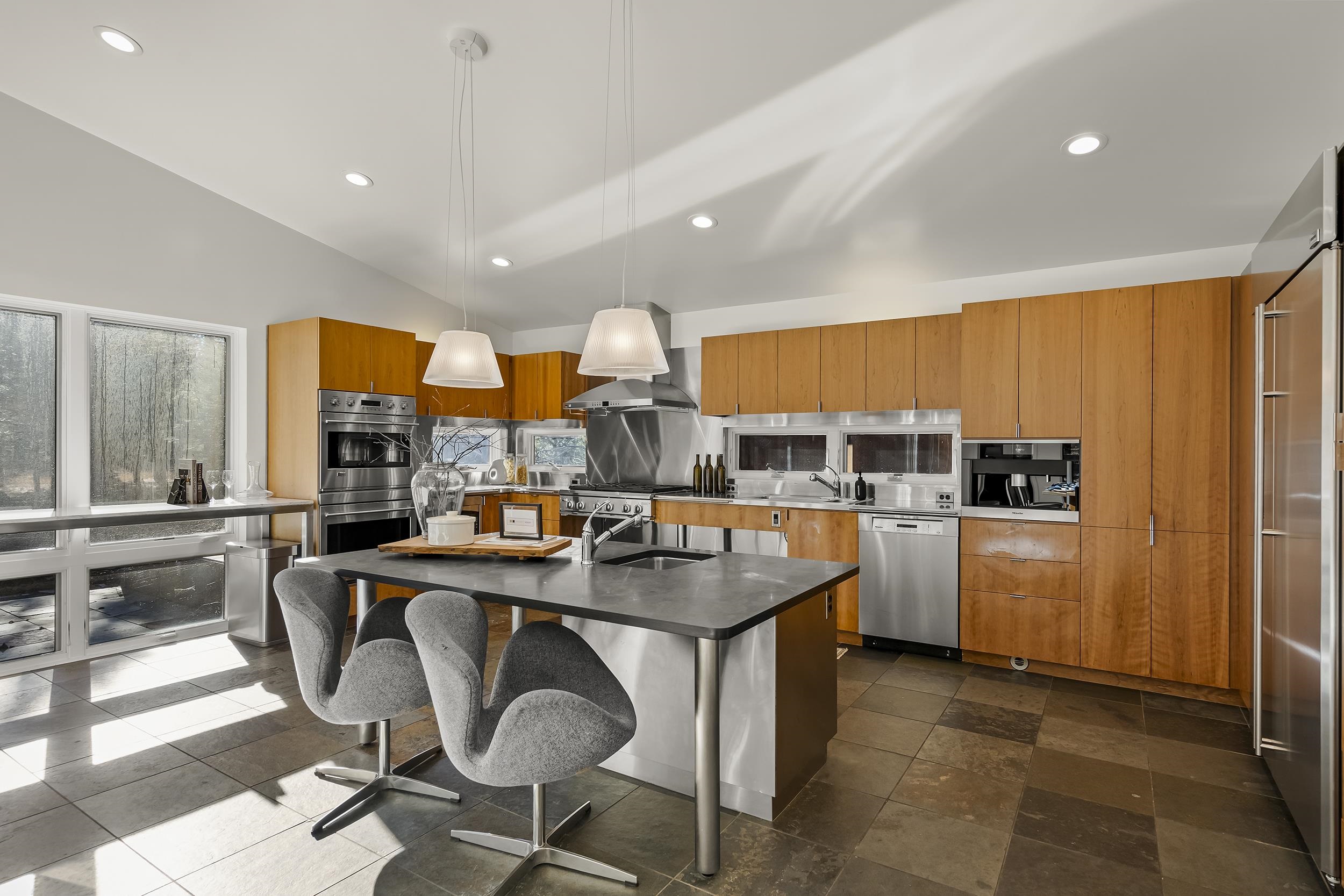 11906 Stallion Way Truckee, CA 96161 - Photo 10 of 20 a kitchen with stainless steel appliances granite countertop a sink and cabinets