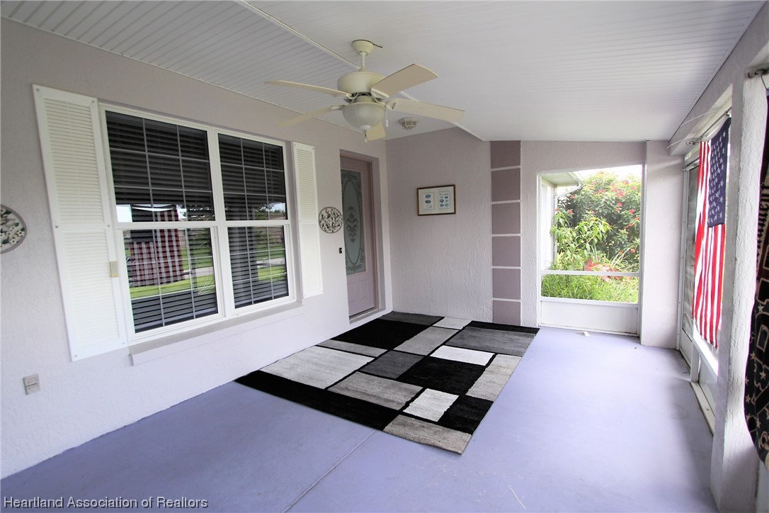 20 Quail Roost Road Lake Placid, FL 33852 - Photo 14 of 28 a living room with furniture and a large window