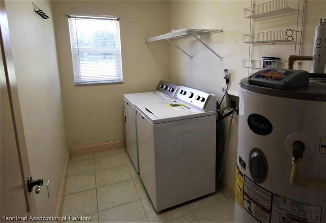 20 Quail Roost Road Lake Placid, FL 33852 - Photo 15 of 28 a utility room with dryer and washer