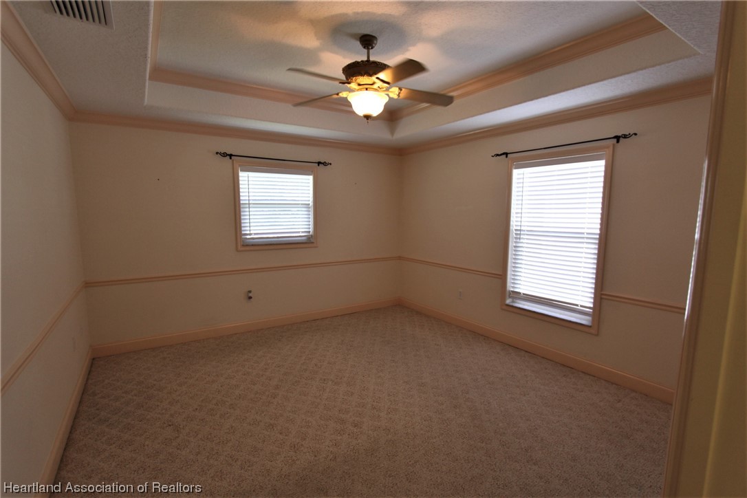 20 Quail Roost Road Lake Placid, FL 33852 - Photo 24 of 28 an empty room with a window and a fan
