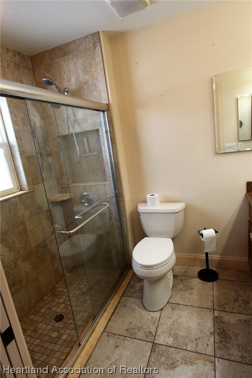 20 Quail Roost Road Lake Placid, FL 33852 - Photo 26 of 28 a bathroom with a toilet and a shower