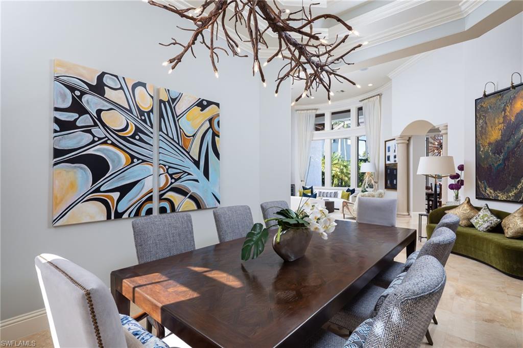 4610 Via Cappello Estero, FL 34134 - Photo 12 of 50 a view of a dining room with furniture