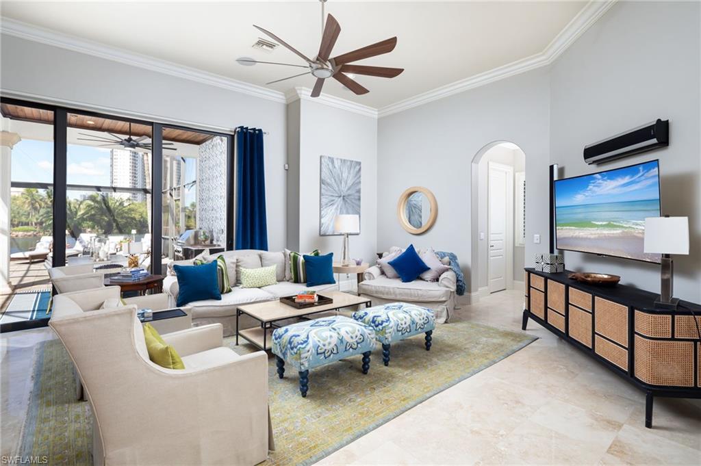 4610 Via Cappello Estero, FL 34134 - Photo 14 of 50 a living room with furniture and a flat screen tv