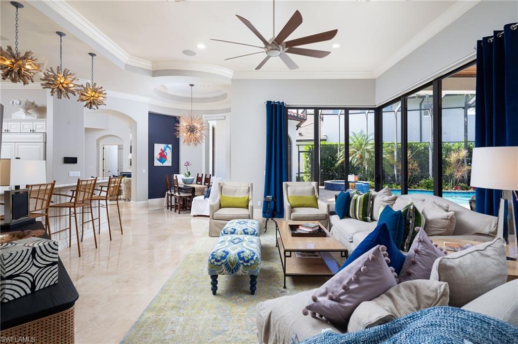 4610 Via Cappello Estero, FL 34134 - Photo 16 of 50 a living room with furniture and a large window
