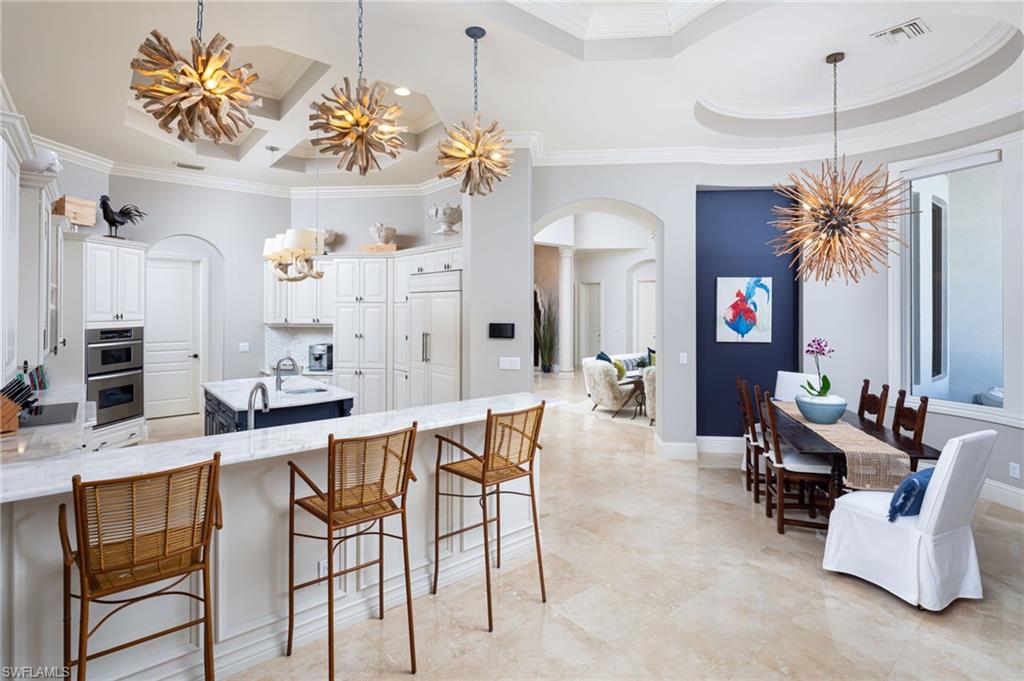 4610 Via Cappello Estero, FL 34134 - Photo 18 of 50 a view of a dining room with furniture