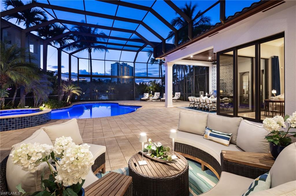 4610 Via Cappello Estero, FL 34134 - Photo 2 of 50 a living room with furniture and wooden floor