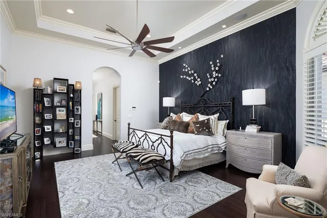 a bedroom with double bed and a window