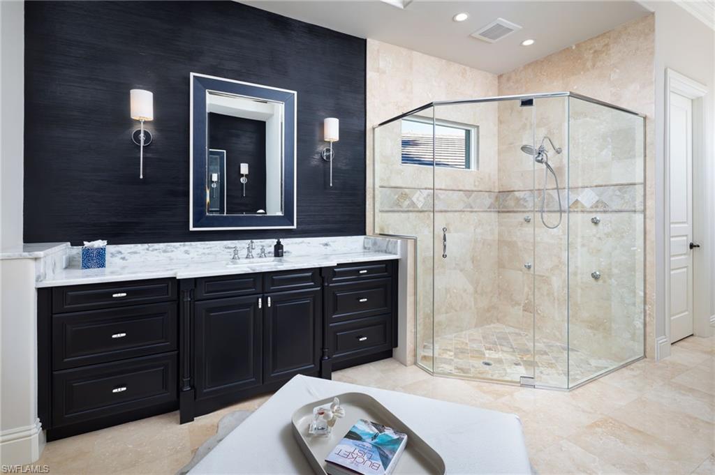4610 Via Cappello Estero, FL 34134 - Photo 24 of 50 a spacious bathroom with a sink double vanity and a mirror