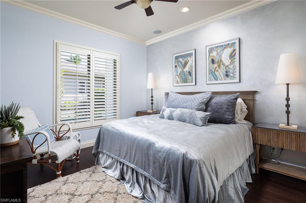 4610 Via Cappello Estero, FL 34134 - Photo 27 of 50 a bedroom with a large bed and a window