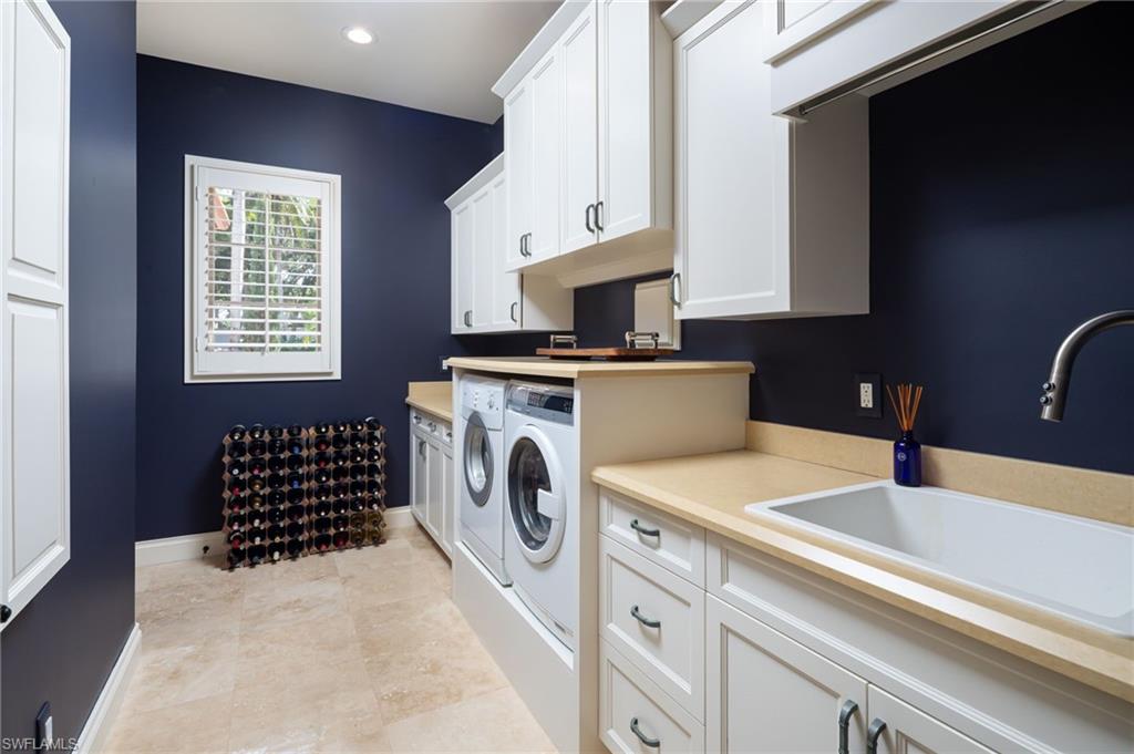 4610 Via Cappello Estero, FL 34134 - Photo 32 of 50 a kitchen with a sink stove and microwave