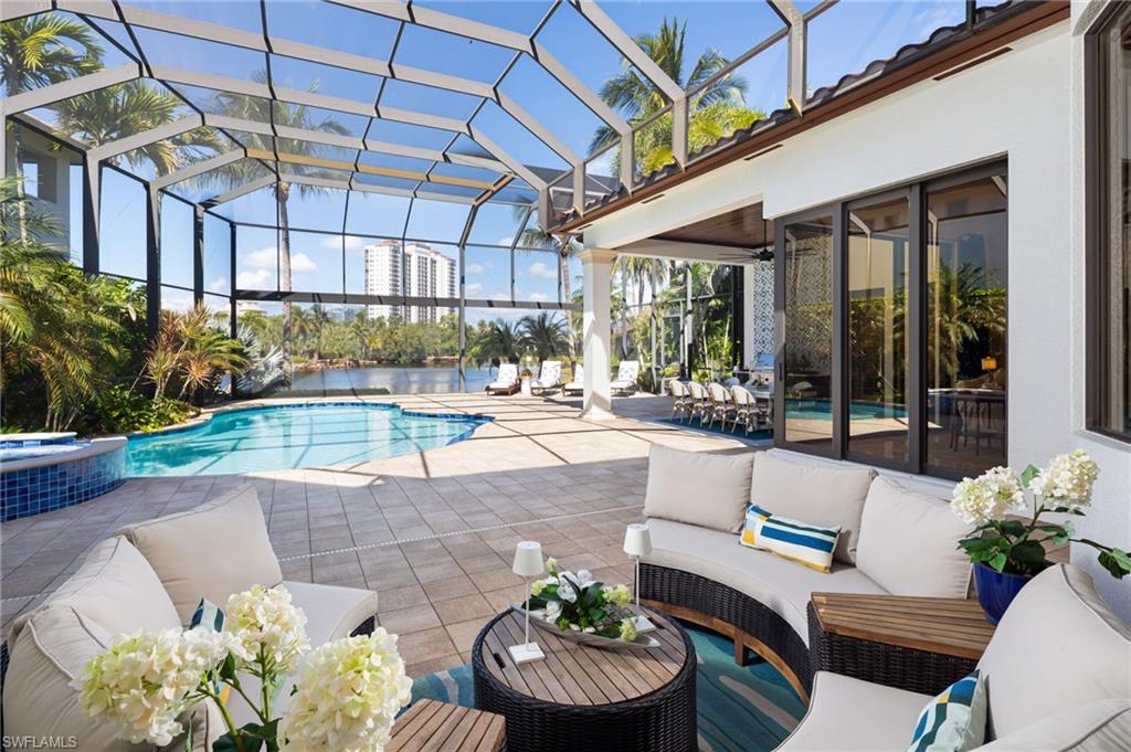 4610 Via Cappello Estero, FL 34134 - Photo 33 of 50 a building outdoor space with patio furniture and potted plants