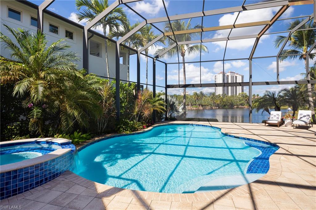 4610 Via Cappello Estero, FL 34134 - Photo 36 of 50 a view of a swimming pool with a patio