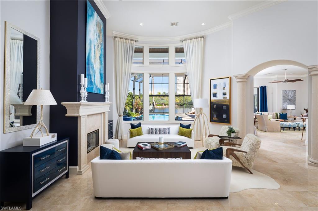 4610 Via Cappello Estero, FL 34134 - Photo 7 of 50 a living room with furniture and a large window