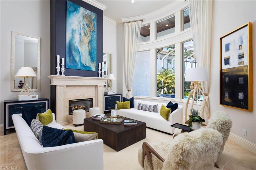 4610 Via Cappello Estero, FL 34134 - Photo 8 of 50 a living room with furniture and a fireplace