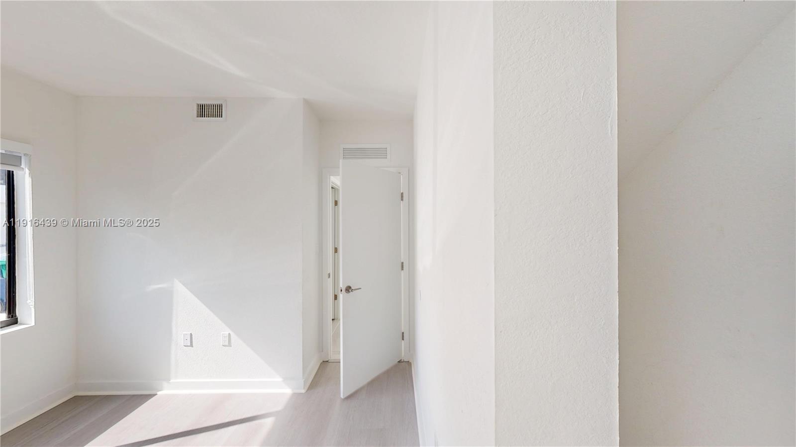 14546 Southwest 260th Street, Unit 14546 Homestead, FL 33032 - Photo 11 of 31 a view of a hallway with closet