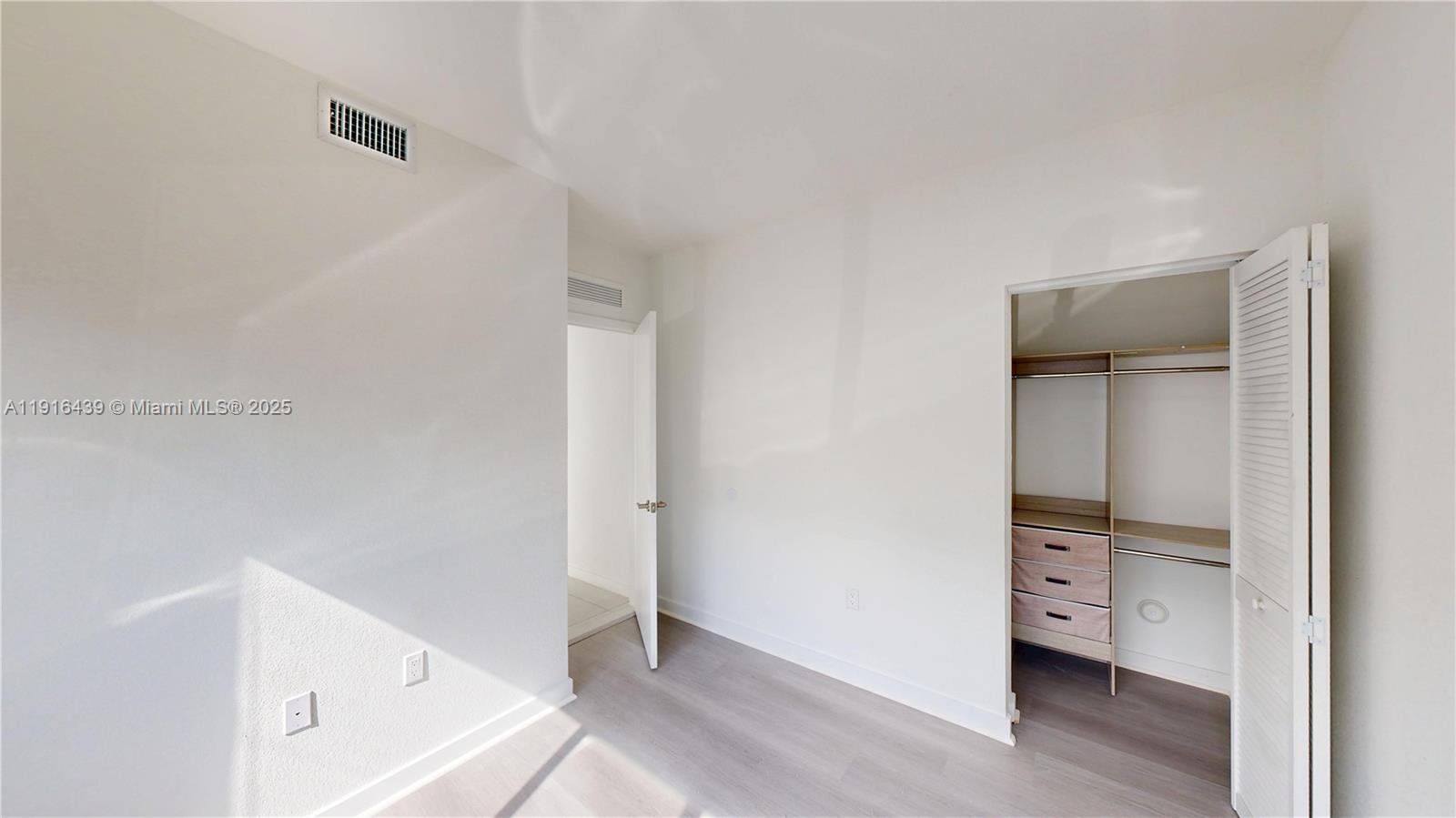 14546 Southwest 260th Street, Unit 14546 Homestead, FL 33032 - Photo 12 of 31 a view of an empty room