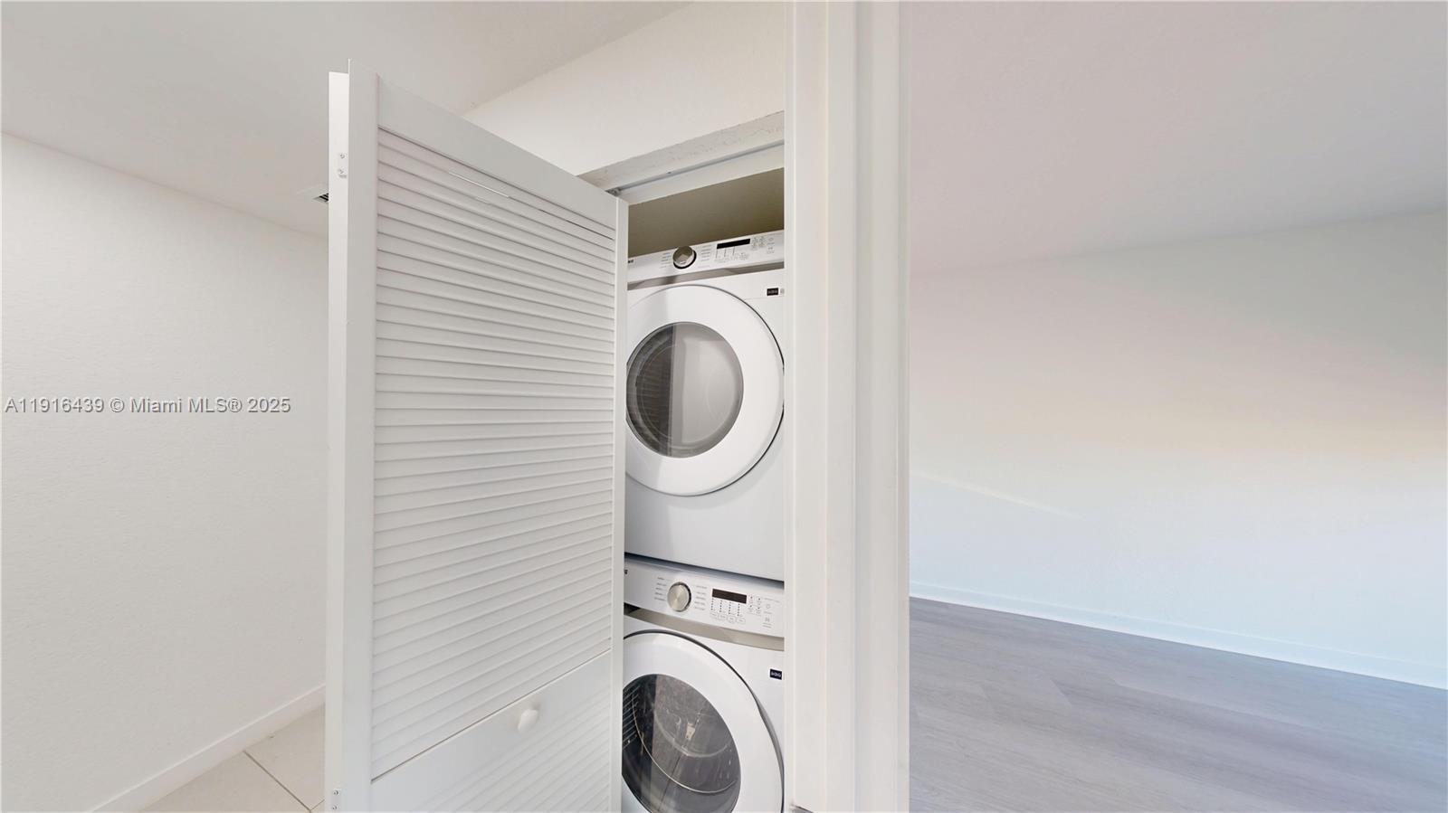 14546 Southwest 260th Street, Unit 14546 Homestead, FL 33032 - Photo 16 of 31 a utility room with dryer and washer