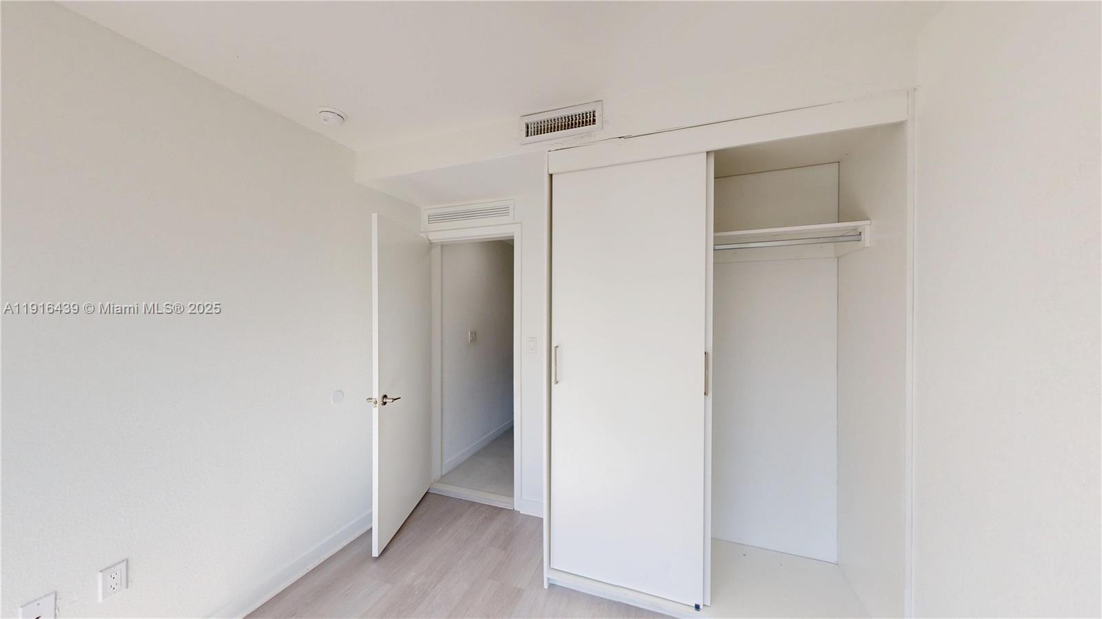 14546 Southwest 260th Street, Unit 14546 Homestead, FL 33032 - Photo 25 of 31 a view of hallway with wooden floor