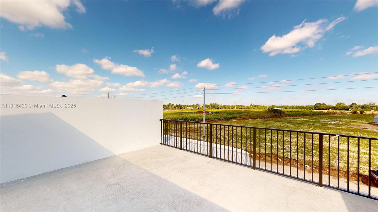 14546 Southwest 260th Street, Unit 14546 Homestead, FL 33032 - Photo 28 of 31 a view of terrace with lake view