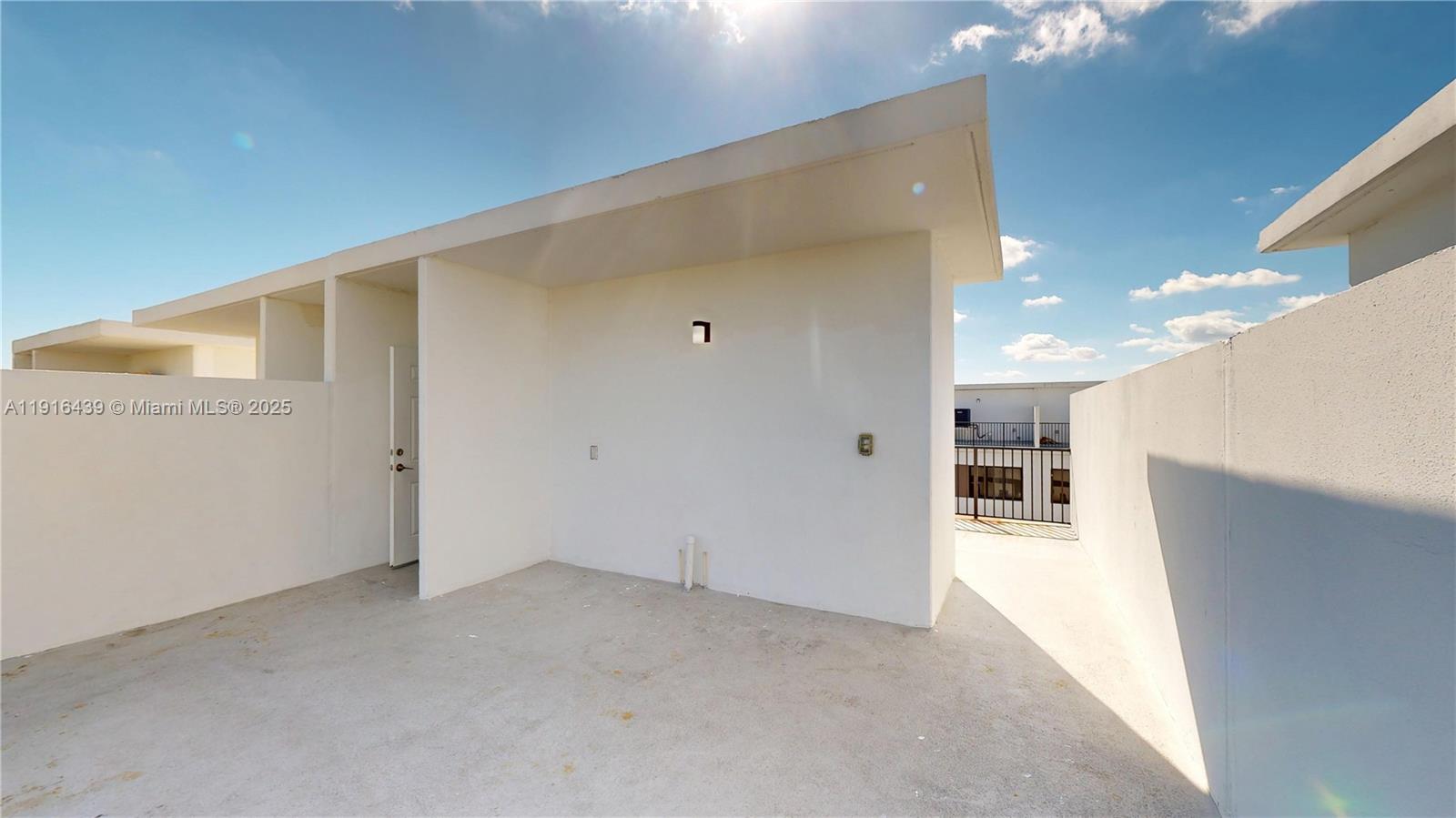 14546 Southwest 260th Street, Unit 14546 Homestead, FL 33032 - Photo 30 of 31 a view of a hallway with kitchen