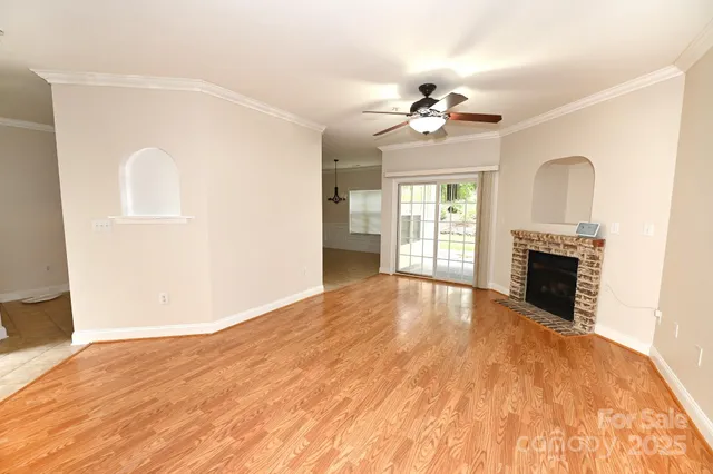 a living room with a fireplace and a table