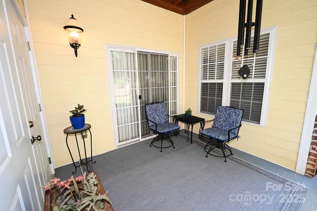 a view of balcony with furniture