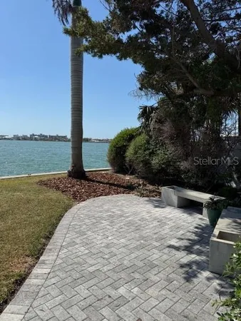 a view of a backyard with a ocean view