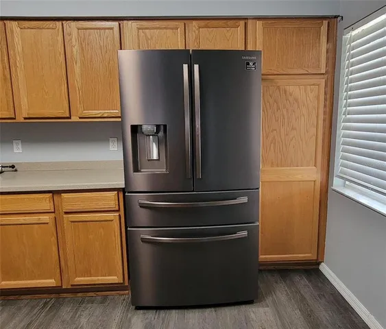 a refrigerator freezer sitting in a kitchen